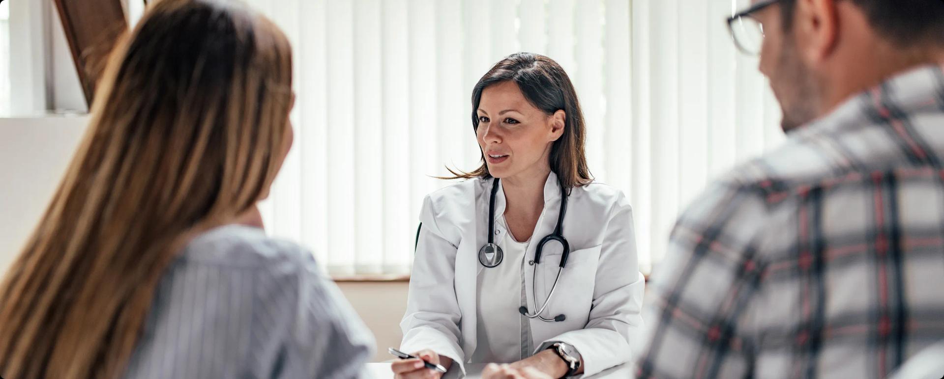 A couple in a consultation with a doctor