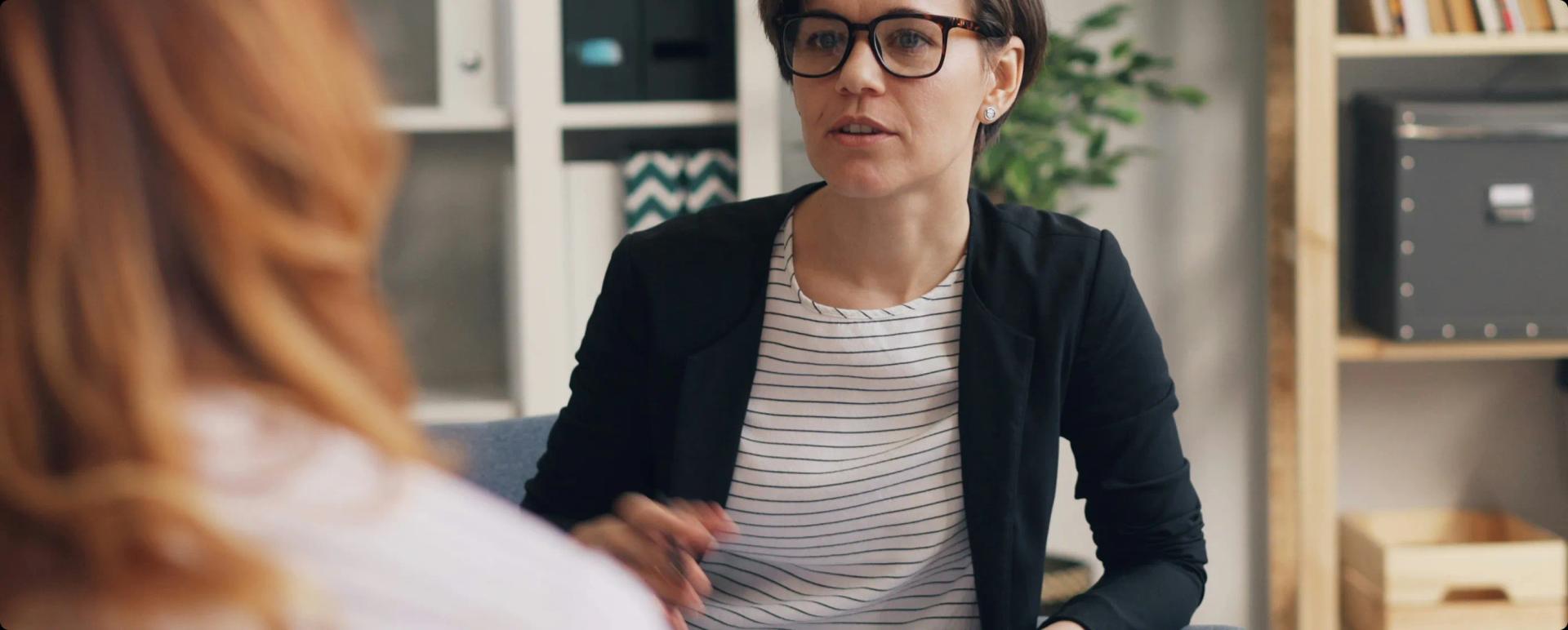 Two people talking through options in a consultation