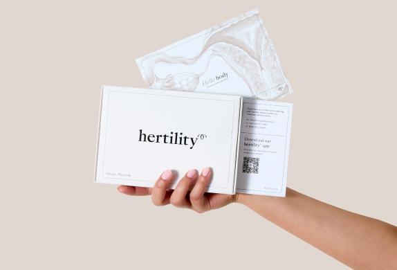 A hand holding the Hertility test